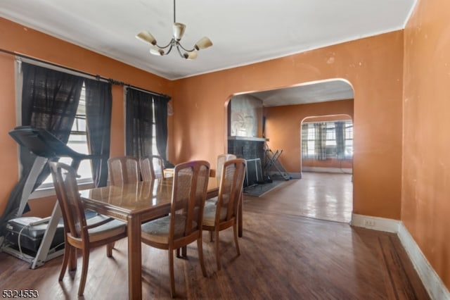 dining area featuring a chandelier and hardwood / wood-style floors