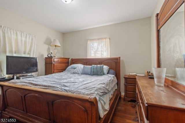 bedroom featuring dark hardwood / wood-style flooring