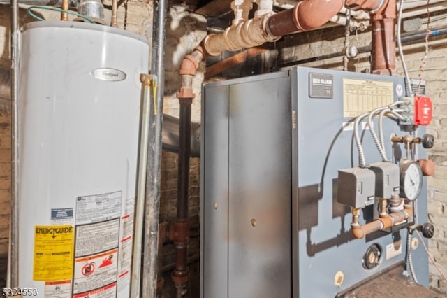 utility room featuring water heater