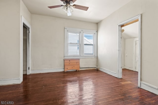 unfurnished bedroom featuring ceiling fan and dark wood-type flooring