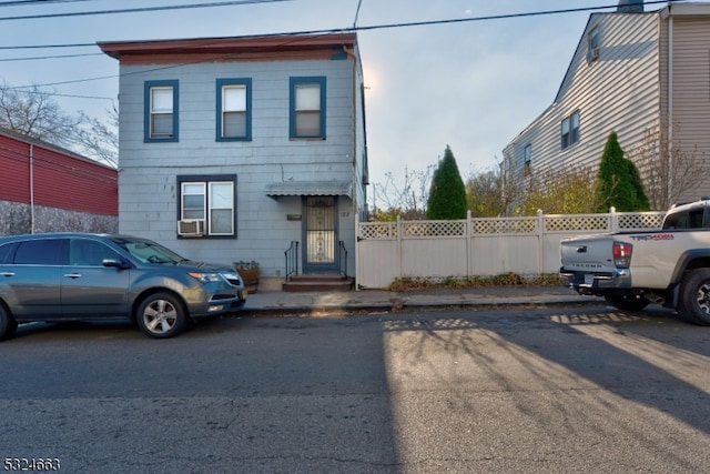 view of front of home with cooling unit