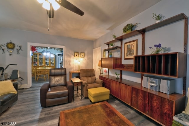 living room with ceiling fan and dark hardwood / wood-style floors