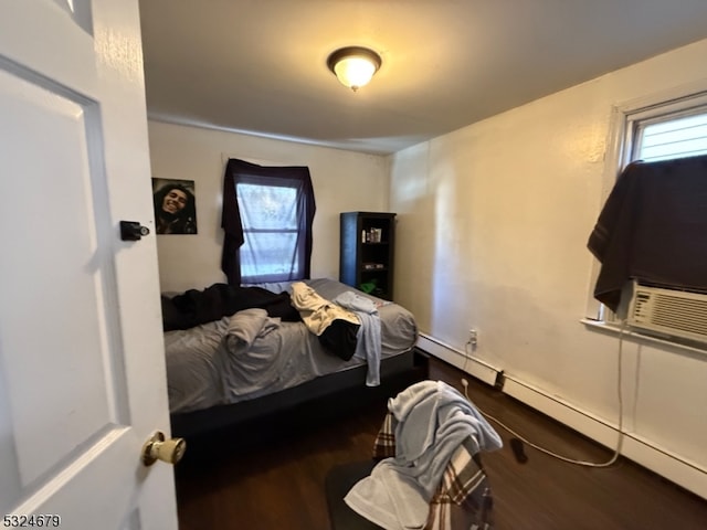 bedroom featuring cooling unit and wood-type flooring