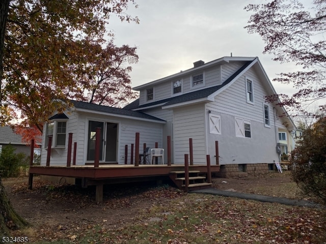 rear view of property with a deck