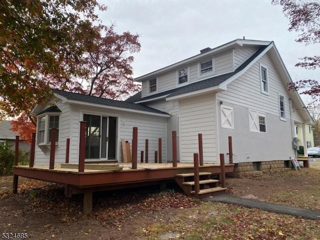 rear view of property with a deck