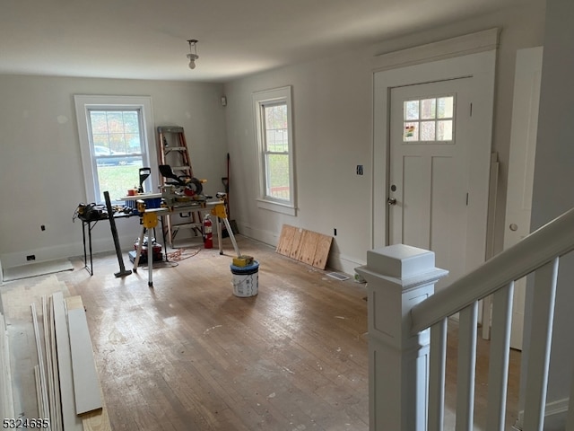 foyer entrance featuring a healthy amount of sunlight and light hardwood / wood-style floors