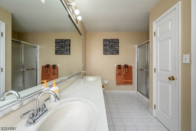 bathroom with tile patterned floors, vanity, and an enclosed shower