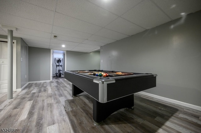 recreation room with a paneled ceiling, hardwood / wood-style floors, and pool table