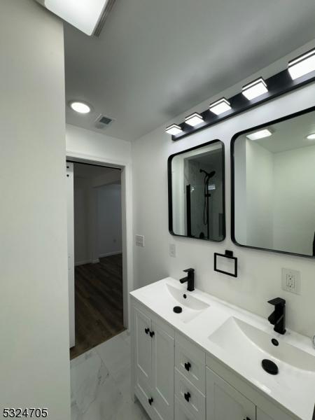 111 E Del A Vue Ave, Carneys Point Twp, NJ 08069 - bathroom featuring marble finish floors and double vanity