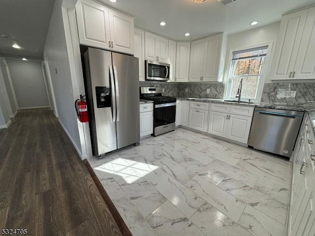 111 E Del A Vue Ave, Carneys Point Twp, NJ 08069 - kitchen with stainless steel appliances, a sink, white cabinetry, stone counters, and recessed lighting