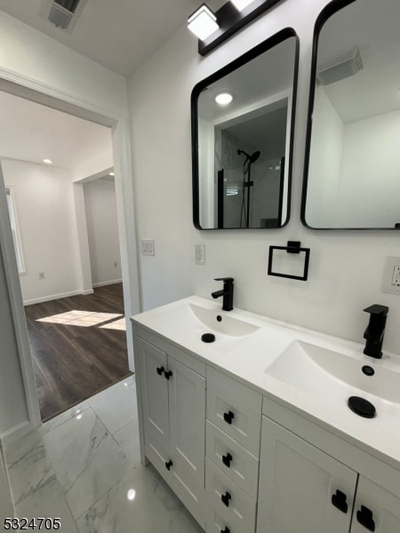 bathroom with wood-type flooring and vanity