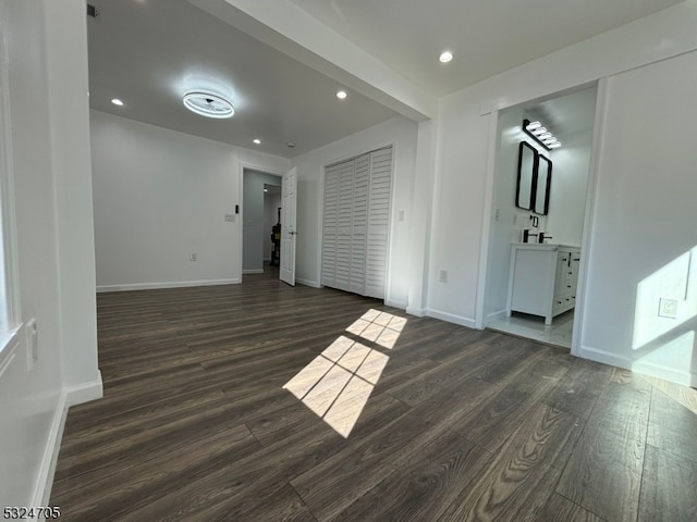 spare room featuring dark wood-type flooring