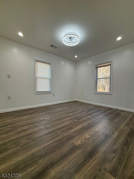 empty room featuring dark hardwood / wood-style floors