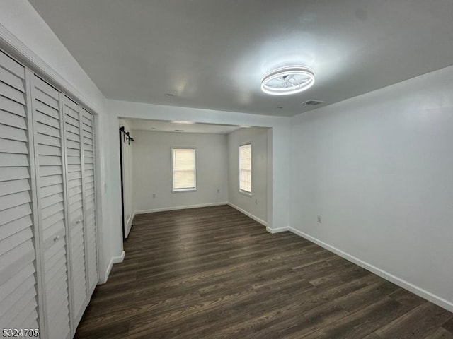 111 E Del A Vue Ave, Carneys Point Twp, NJ 08069 - unfurnished bedroom featuring dark wood-style flooring and baseboards