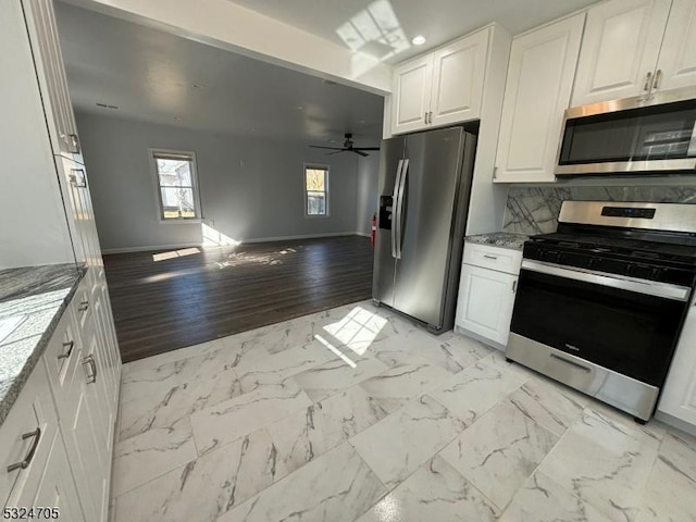 111 E Del A Vue Ave, Carneys Point Twp, NJ 08069 - kitchen featuring stainless steel appliances, white cabinetry, open floor plan, ceiling fan, and baseboards