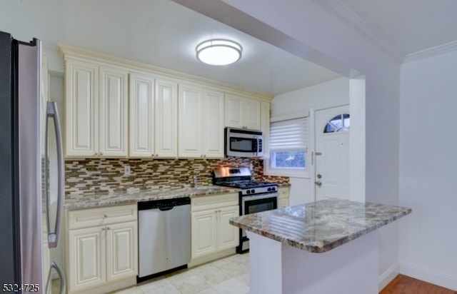 kitchen featuring kitchen peninsula, light stone countertops, crown molding, and stainless steel appliances