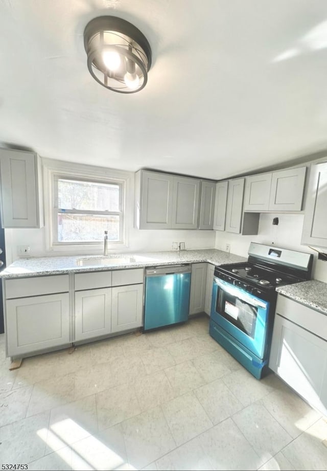 kitchen with gray cabinets, dishwasher, and stove