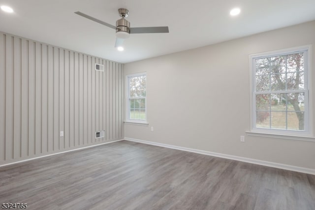 unfurnished room with ceiling fan and light hardwood / wood-style floors