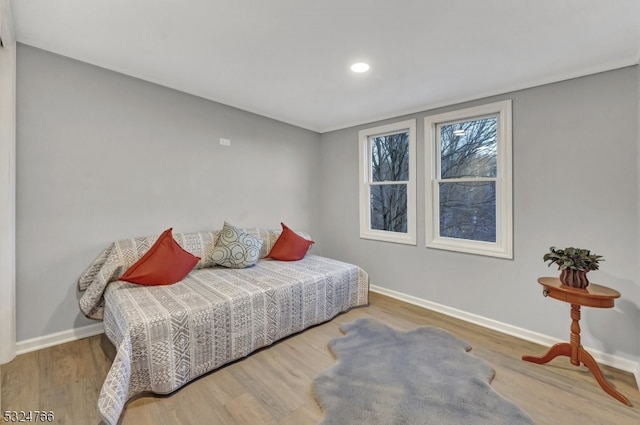 bedroom with hardwood / wood-style floors