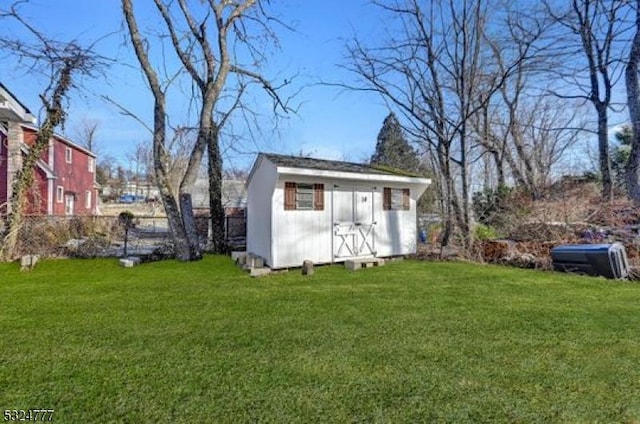 view of outbuilding featuring a yard