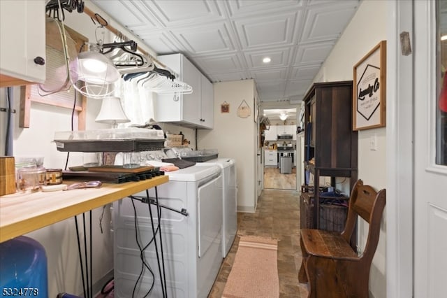 laundry area featuring cabinets and washer and dryer