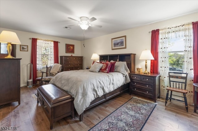 bedroom featuring wood-type flooring and ceiling fan