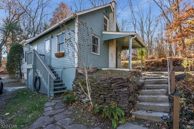 view of property exterior with covered porch