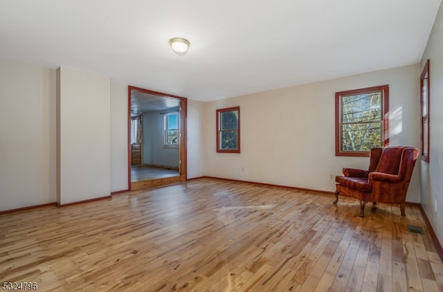 living area with light hardwood / wood-style flooring