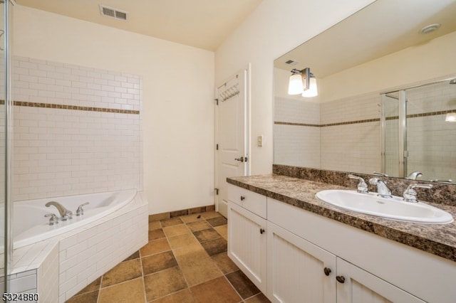 bathroom with plus walk in shower and vanity