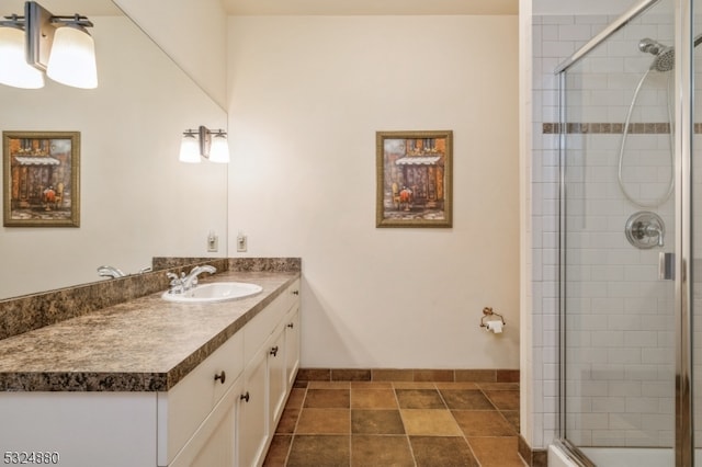 bathroom with tile patterned flooring, vanity, and a shower with shower door