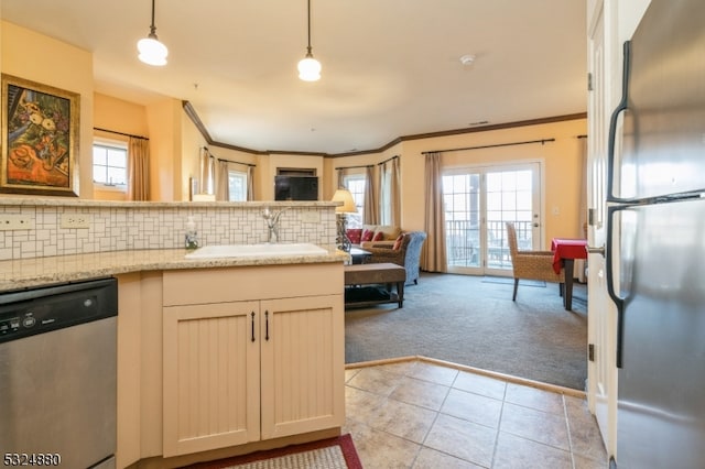 kitchen featuring decorative backsplash, light tile patterned floors, stainless steel appliances, and hanging light fixtures