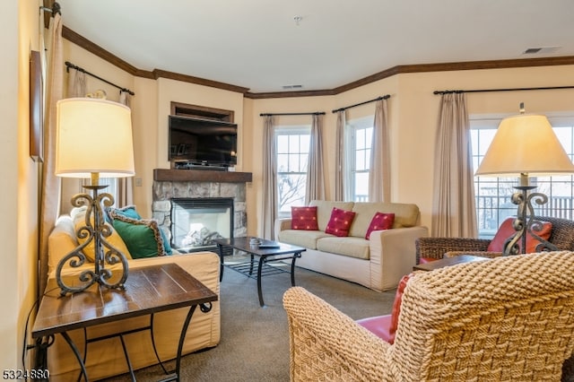 carpeted living room featuring ornamental molding and a fireplace