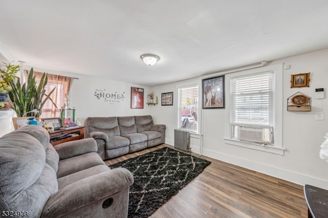 living room with hardwood / wood-style floors and cooling unit