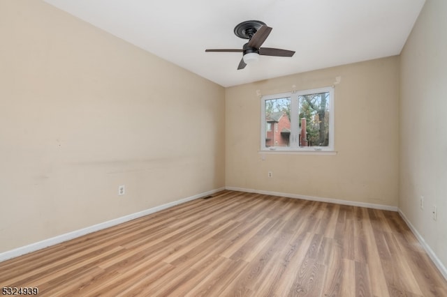 unfurnished room with light wood-type flooring and ceiling fan