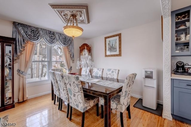 dining area with light hardwood / wood-style flooring