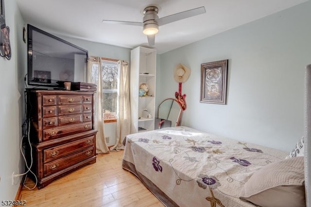 bedroom featuring ceiling fan and light hardwood / wood-style flooring