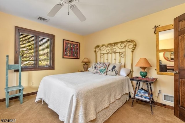 bedroom with ceiling fan and light colored carpet