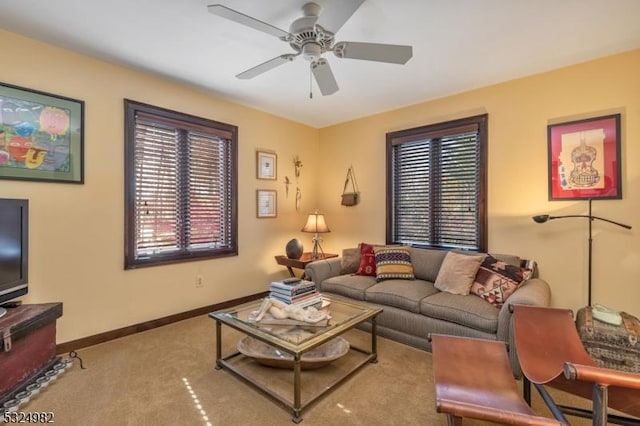 carpeted living room with ceiling fan and a wealth of natural light