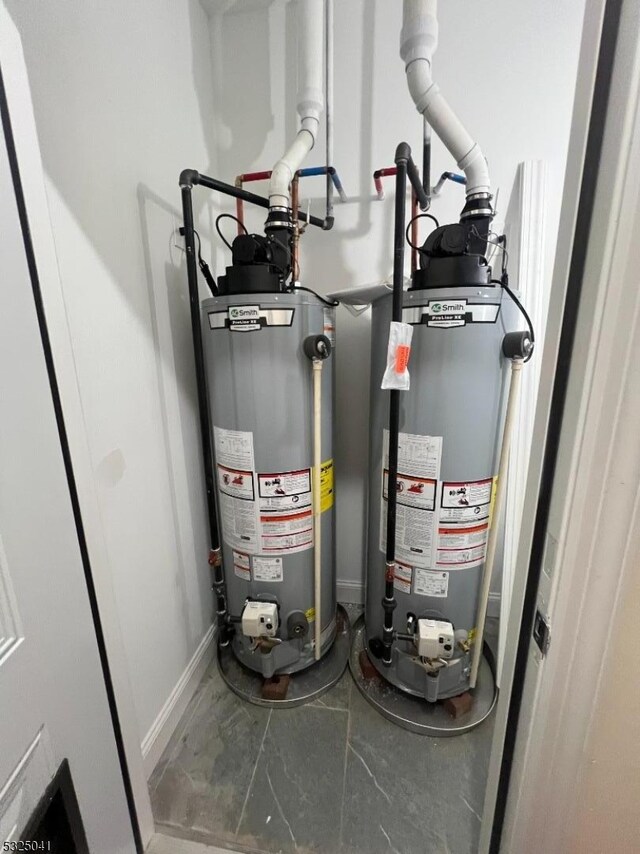 utility room featuring water heater