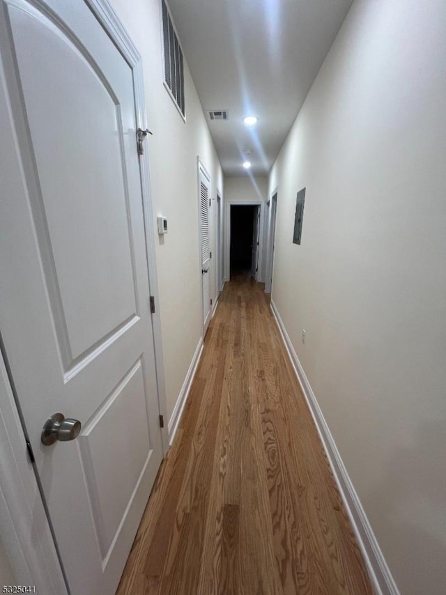 hallway featuring wood-type flooring