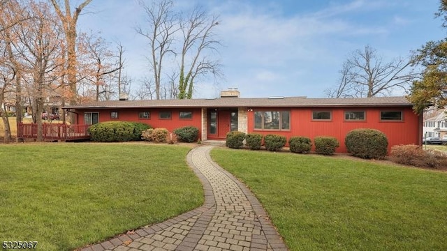 ranch-style house with a front lawn