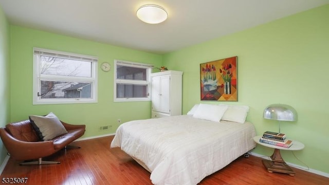 bedroom with hardwood / wood-style floors