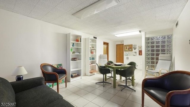 sitting room with light tile patterned floors and a textured ceiling