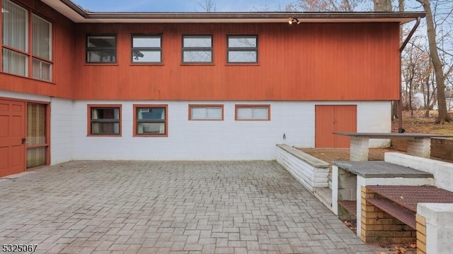 view of side of property with a patio