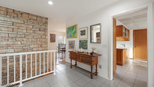 corridor featuring light tile patterned flooring