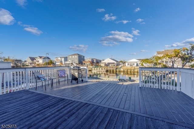 wooden terrace with a water view