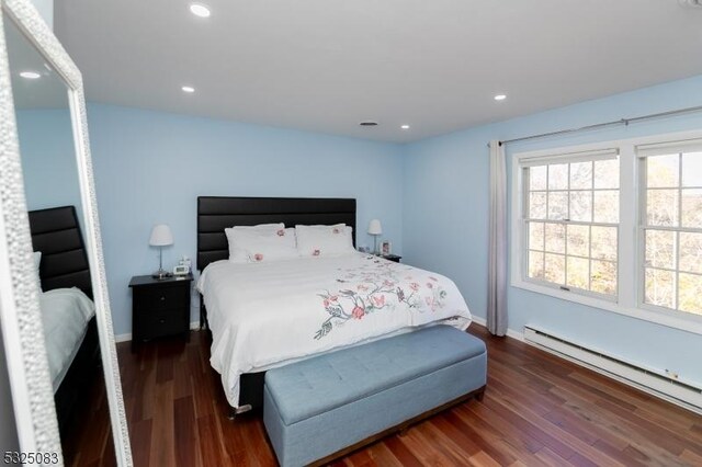 203 E Main St, Prospect Park Boro, NJ 07508 - bedroom featuring a baseboard radiator, dark wood-type flooring, baseboards, and recessed lighting