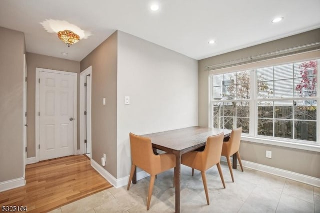 dining room with light hardwood / wood-style flooring