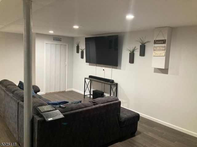 living room with dark hardwood / wood-style flooring