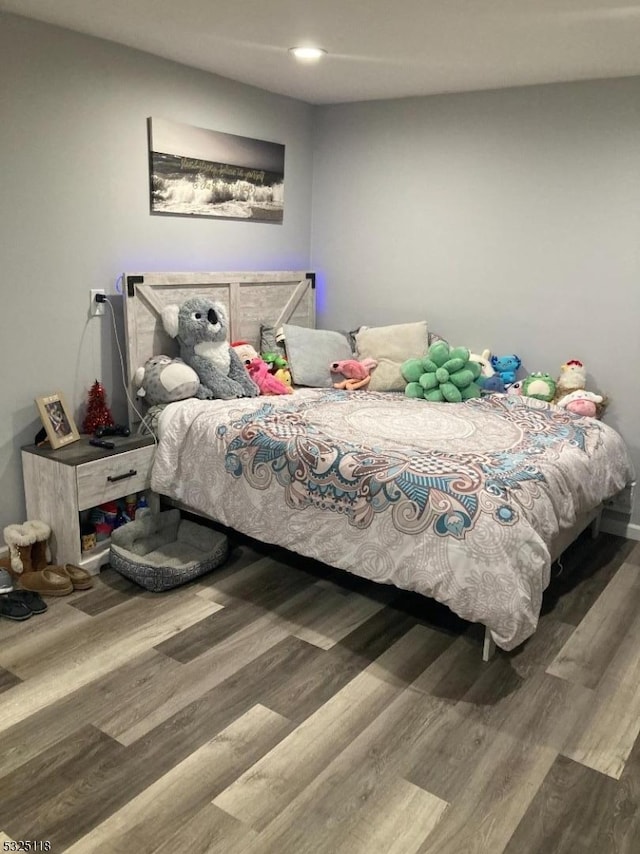 bedroom featuring wood-type flooring